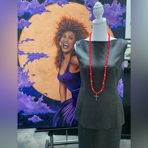 Dramatic orange and silver necklace with a silver cross